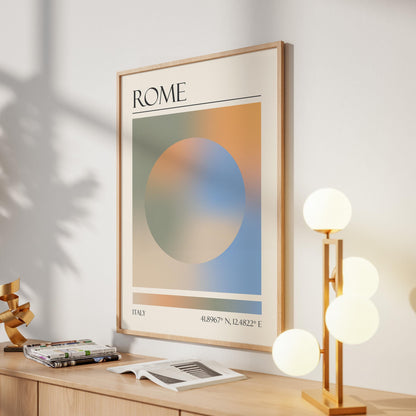 A framed print with the word "ROME" at the top. The destination artwork features a colourful aura circle in teal, orange, blue and beige. A gold lamp with four white globe lights is to the right in the hallway.