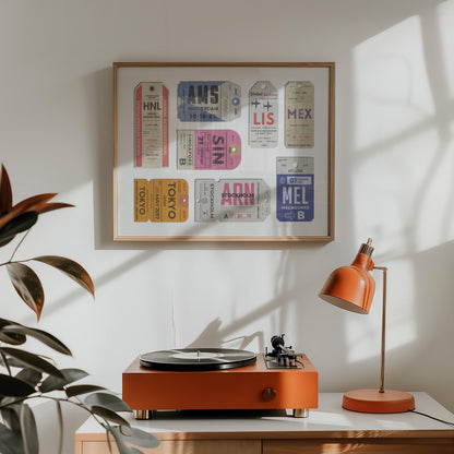 a retro style home with a wood framed poster with personalised airport tags on it