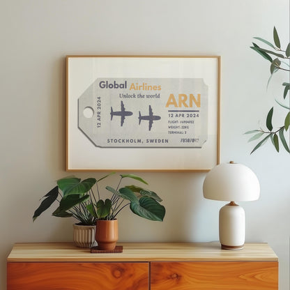 A wood dressed with a lamp plant and poster hung on the wall above. The art is an aviation tag from an airport with plane graphics, rustic edges and worn details like an old ticket.