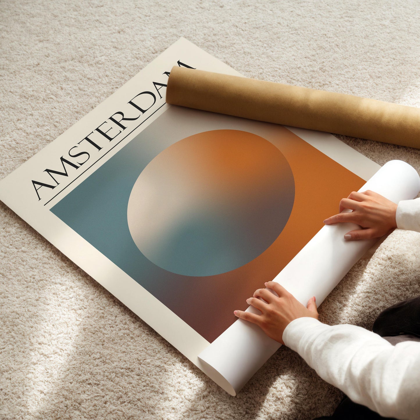 A rolled-up white poster and a brown cardboard tube are also visible. The travelling inspired print is for lovers of spiritual design and calm art.