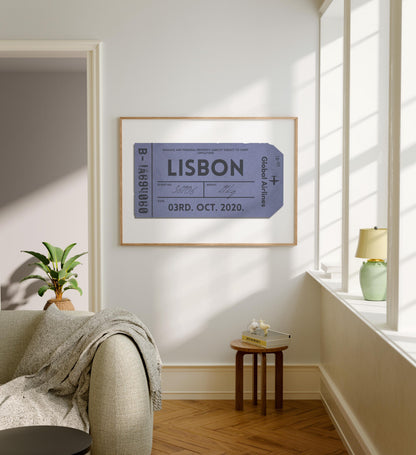 A modern family home with grey furniture and white walls. The art is an eclectic vintage style illustration of a luggage tag featuring your favourite destination, city or special holiday place.