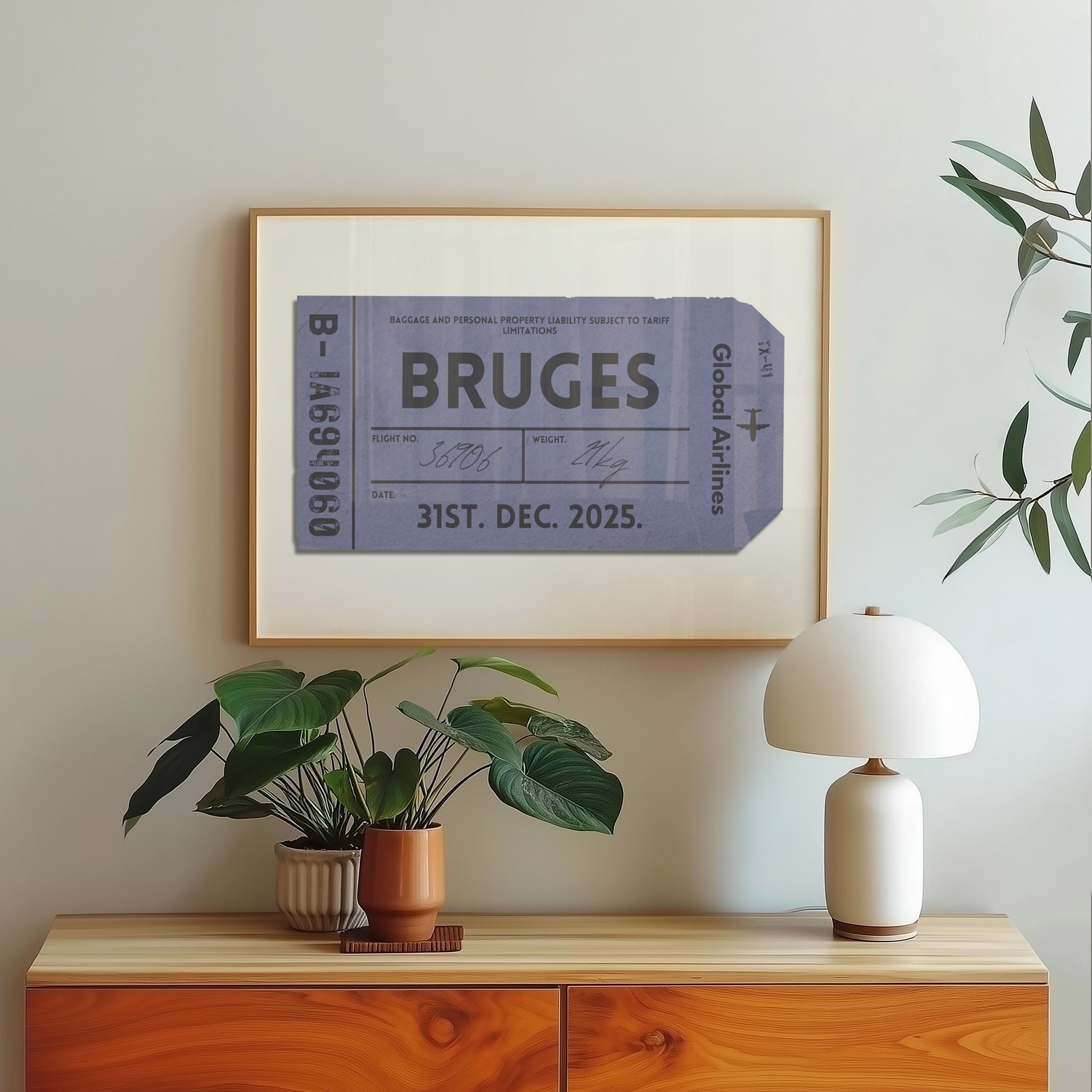A wood dressed with a lamp plant and poster hung on the wall above. The art is an aviation tag from an airport with plane graphics, rustic edges and worn details like an old ticket.
