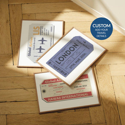 wood herringbone floor with three framed prints laid out on it. The art is of retro boarding passes personalised with dates, airports and destinations