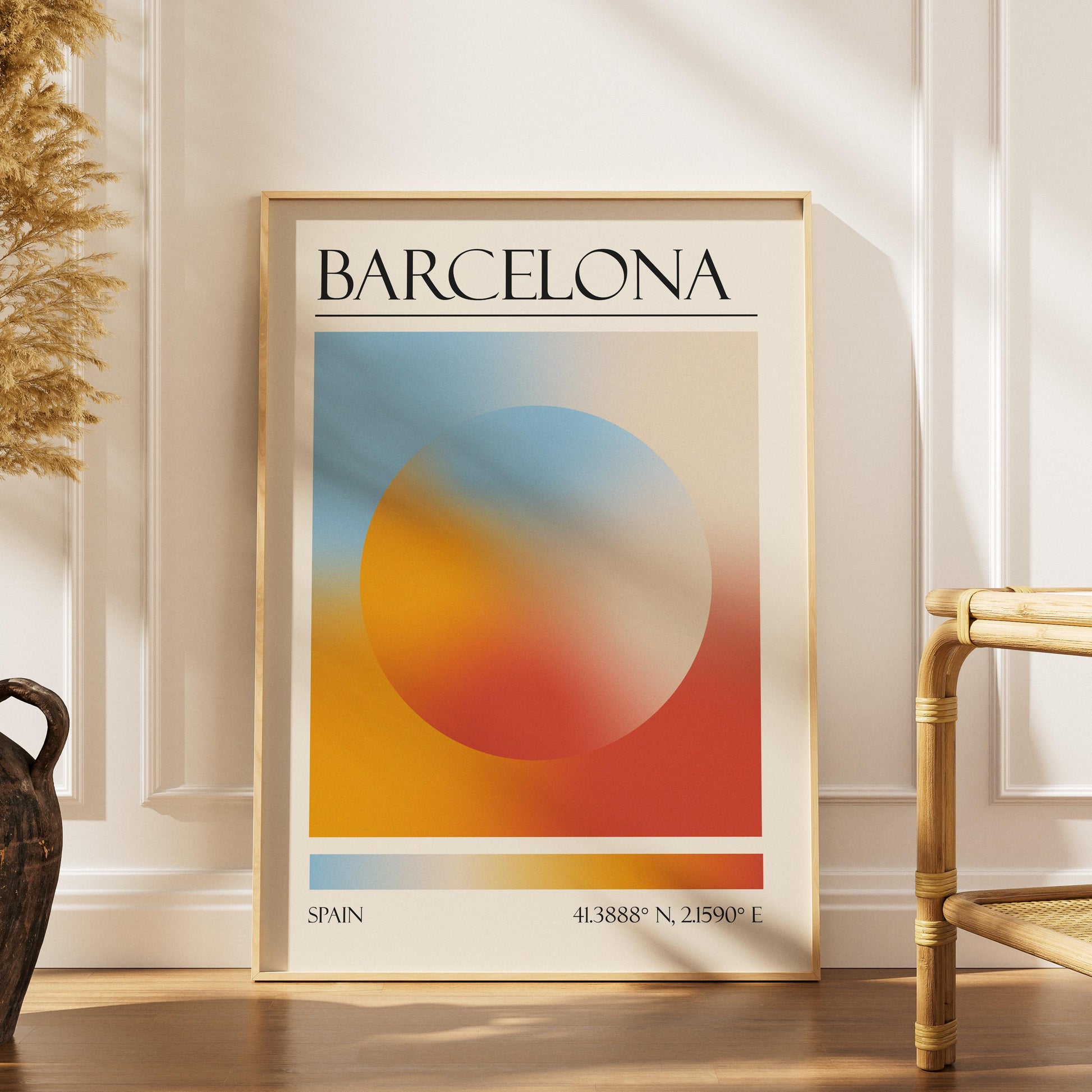 A boho scandi style home living room with a colourful poster leaning on the wall. The art is a dopamine decor style aura print with the colours of Barcelona.