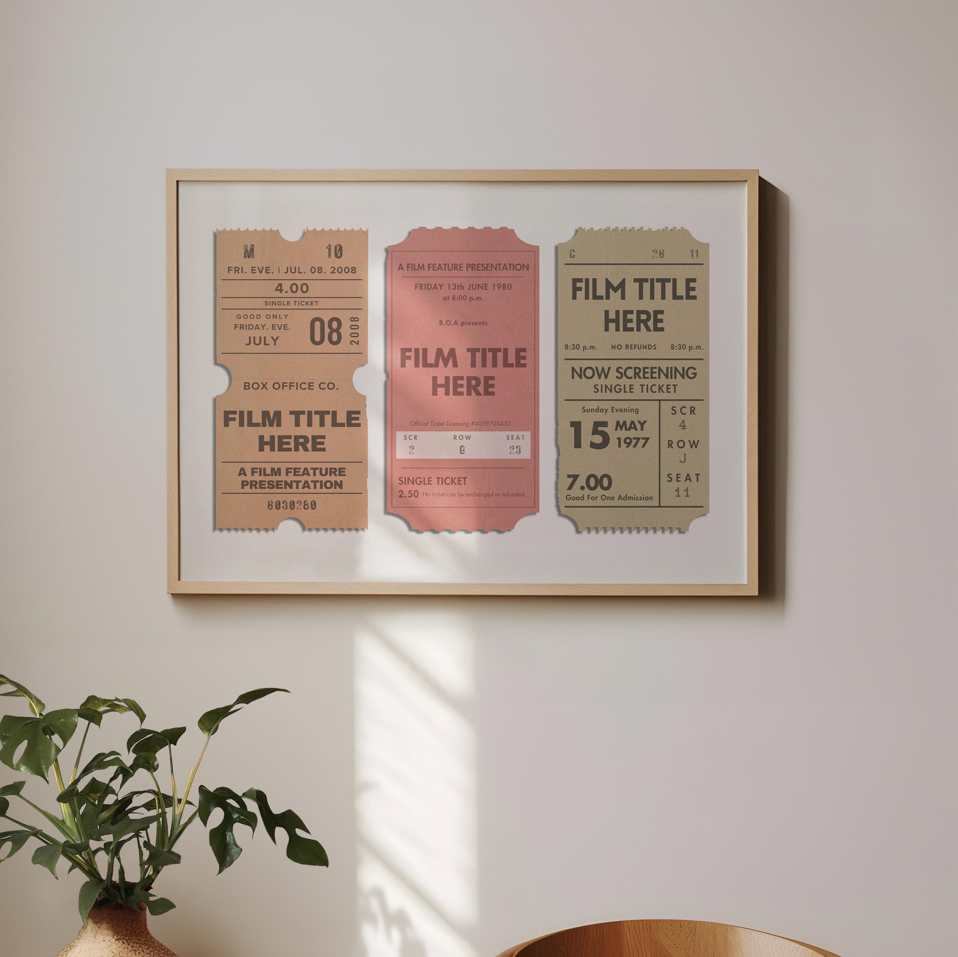 A keepsake style personalised poster hung on the wall above a plant and wood chair. The art is personal, vintage style and perfect for cinephile film lovers.