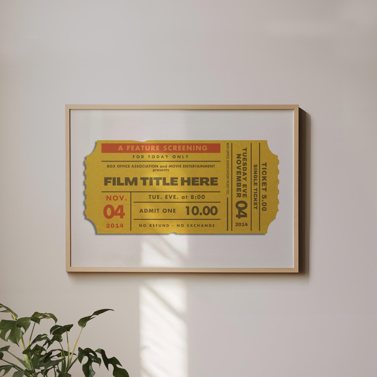 A landscape framed art print hung on a white wall. The poster has a vintage movie ticket on it in a yellow tone showing a unique film with date and production.