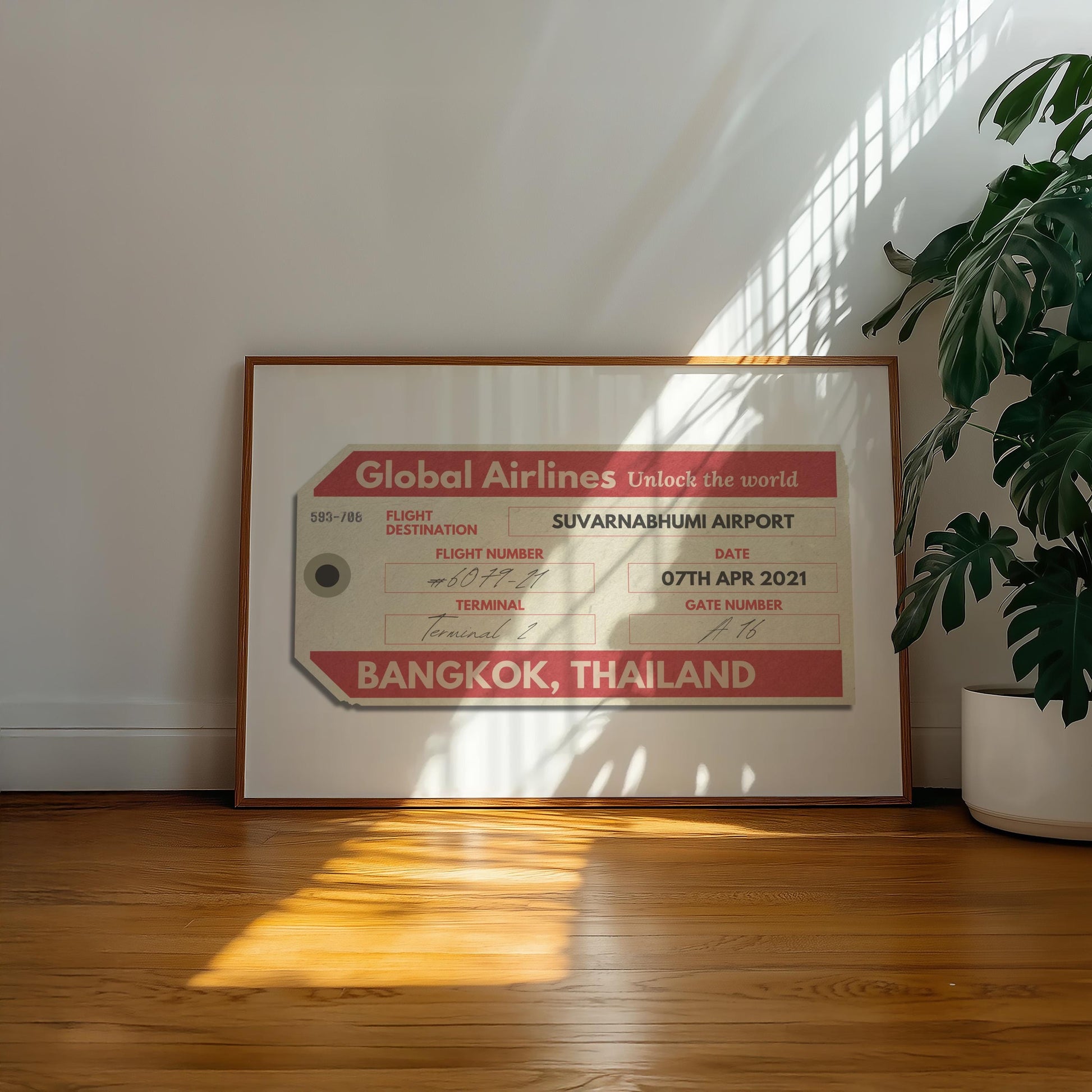 A minimalist home with a large landscape gallery wall piece on the floor. The art has vintage details inspired by a retro luggage tag