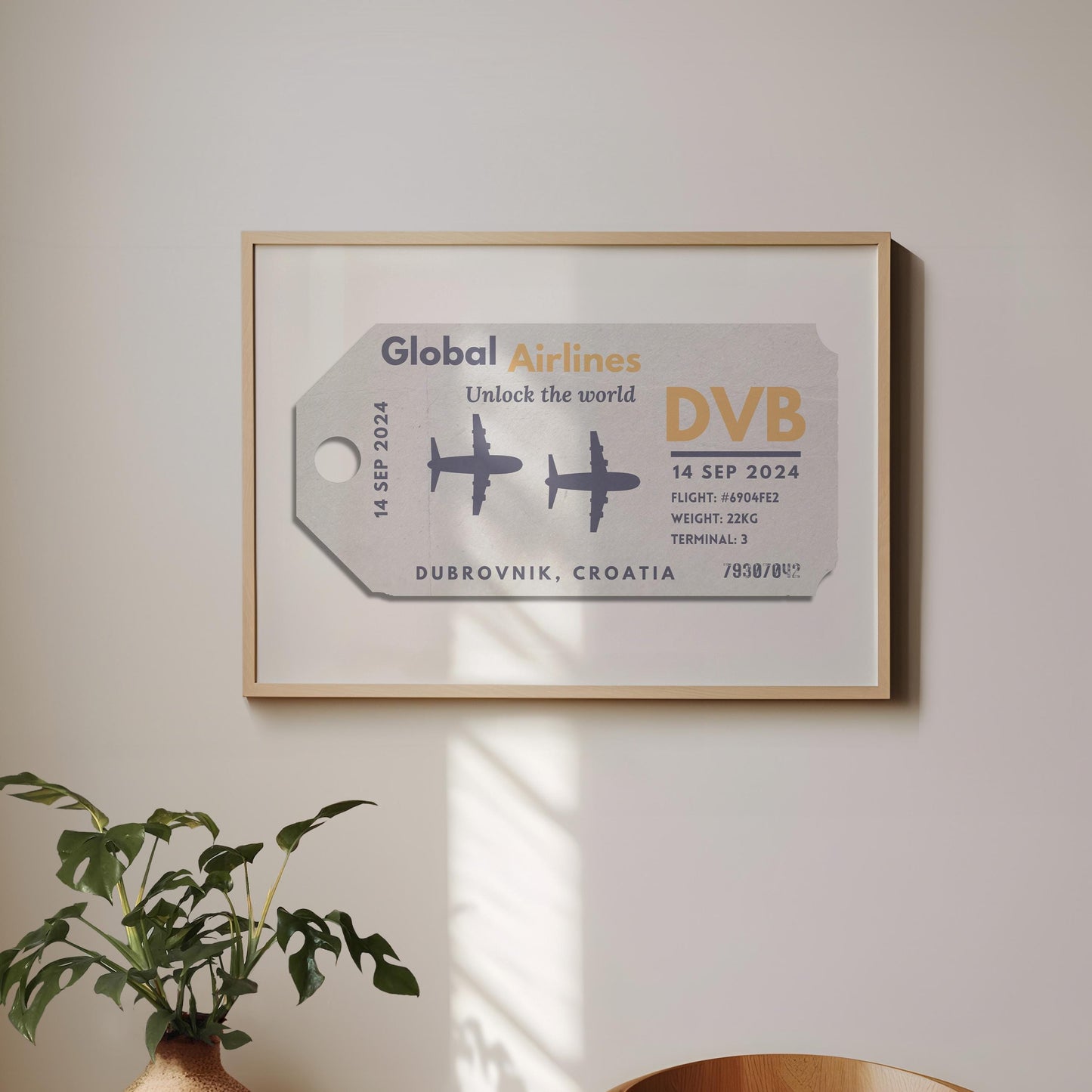 A minimalist home with a large landscape gallery wall piece hung up. The art has vintage details inspired by a retro luggage tag