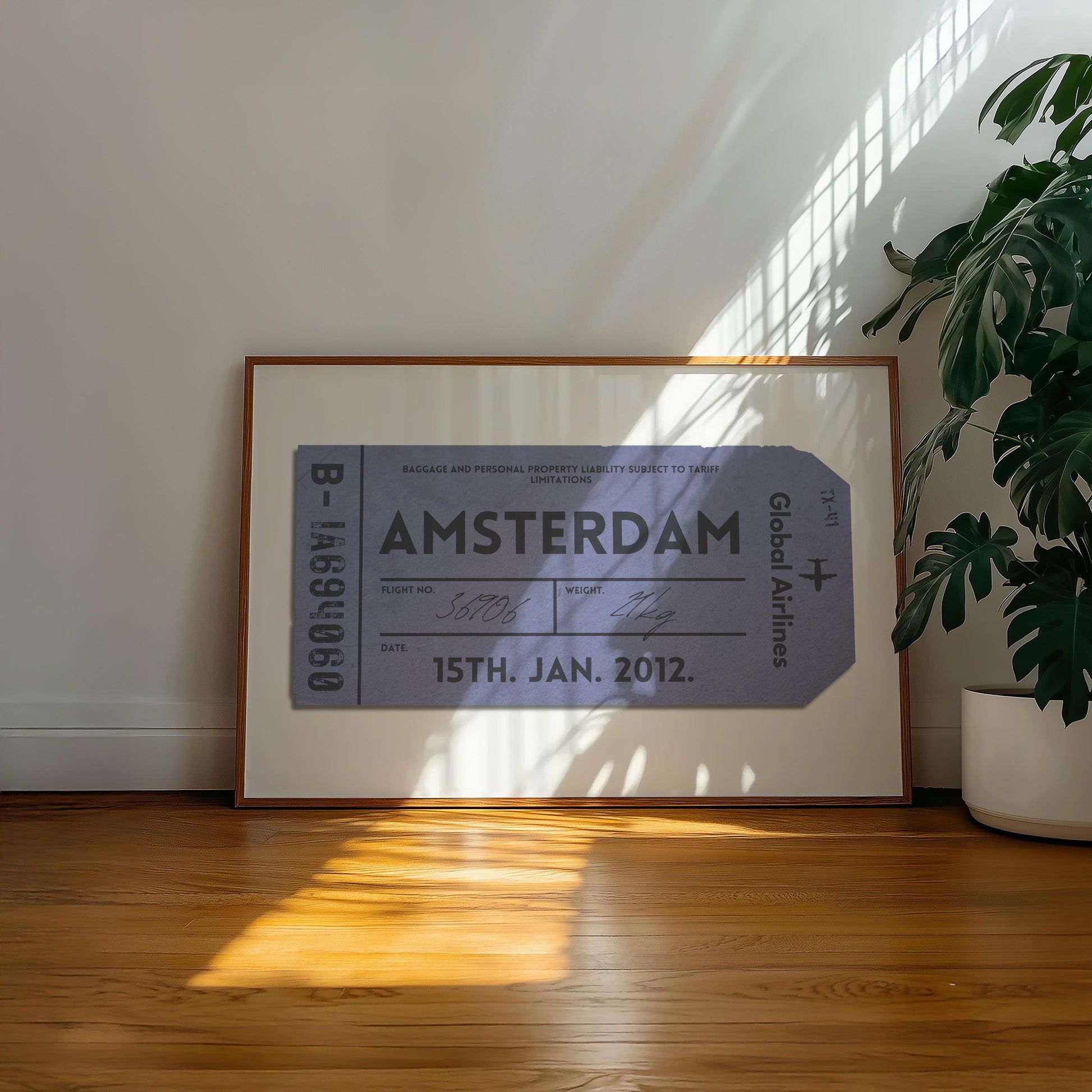 A minimalist home with a large landscape gallery wall piece on the floor. The art has vintage details inspired by a retro luggage tag