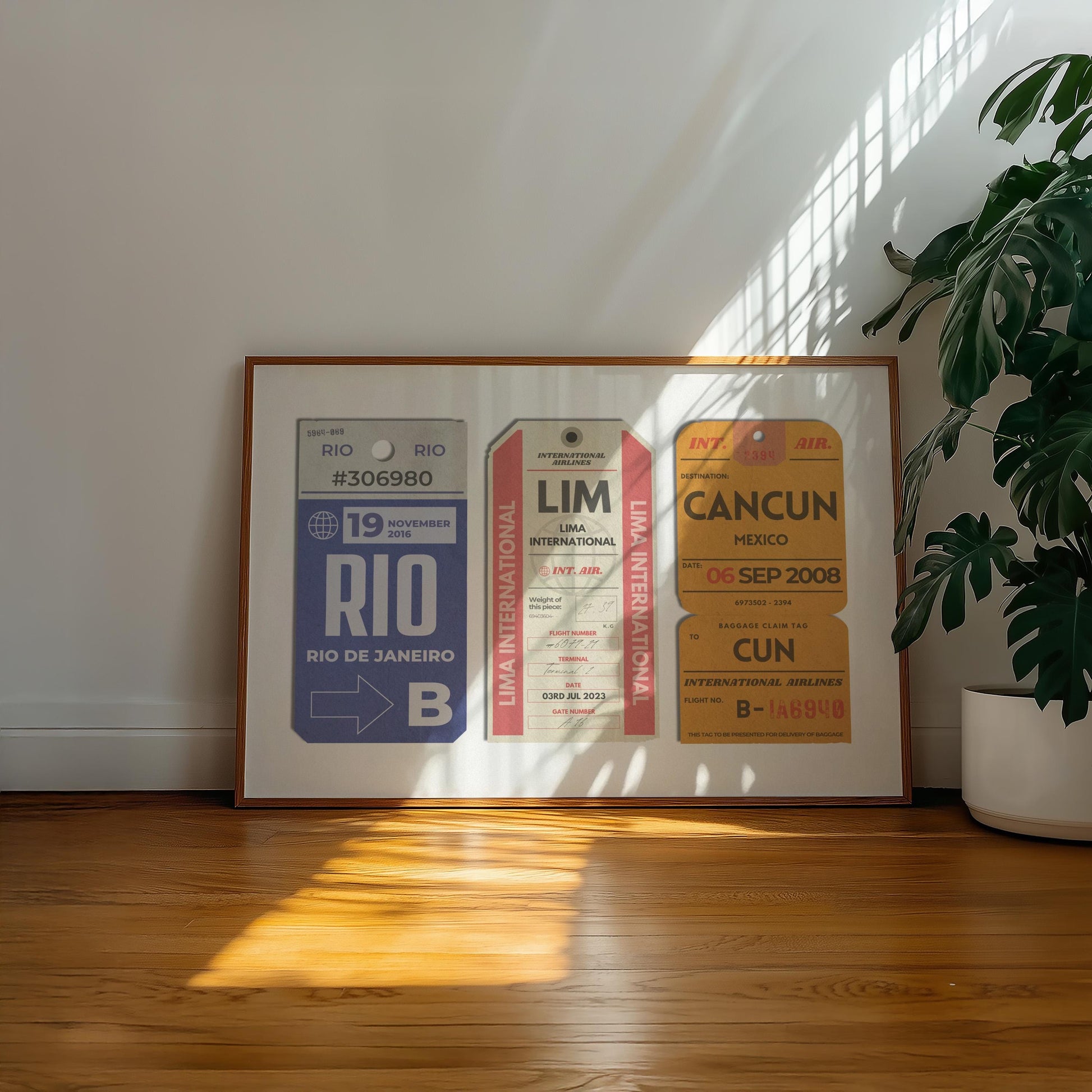 A minimalist home with a large landscape gallery wall piece on the floor. The art has vintage details inspired by a retro luggage tags