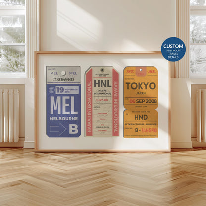 A scandi minimal apartment with a landscape frame leaning on the wall. The art shows a bundle of vintage luggage tags with personalised details on them.