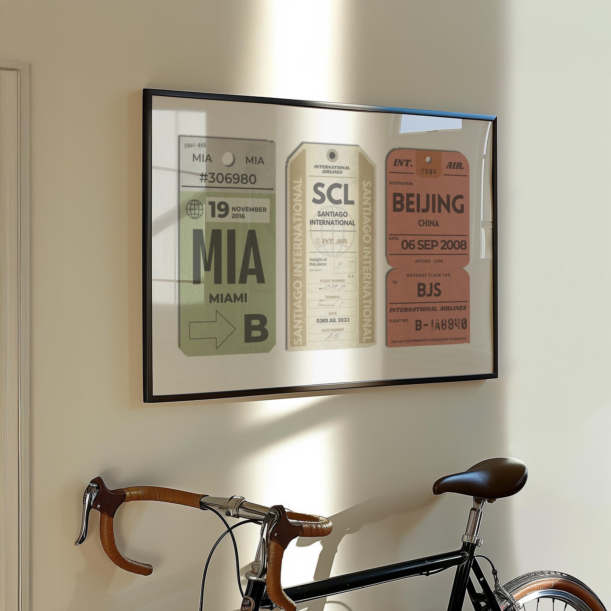 A European style apartment hallway with a bike leaning on the wall. Art above is a vintage muted tones print showing a personalised boarding pass design inspired by travelling.