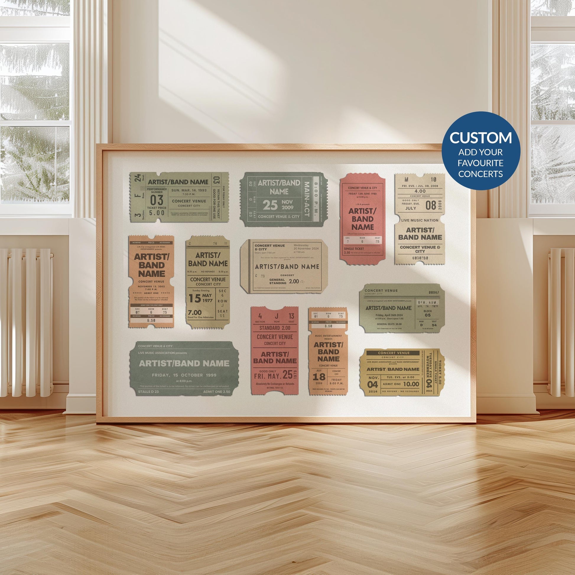 A scandi modern apartment with a large horizontal print leaning on the wall. The art is of multiple vintage concert ticket stubs with personalised text on them.