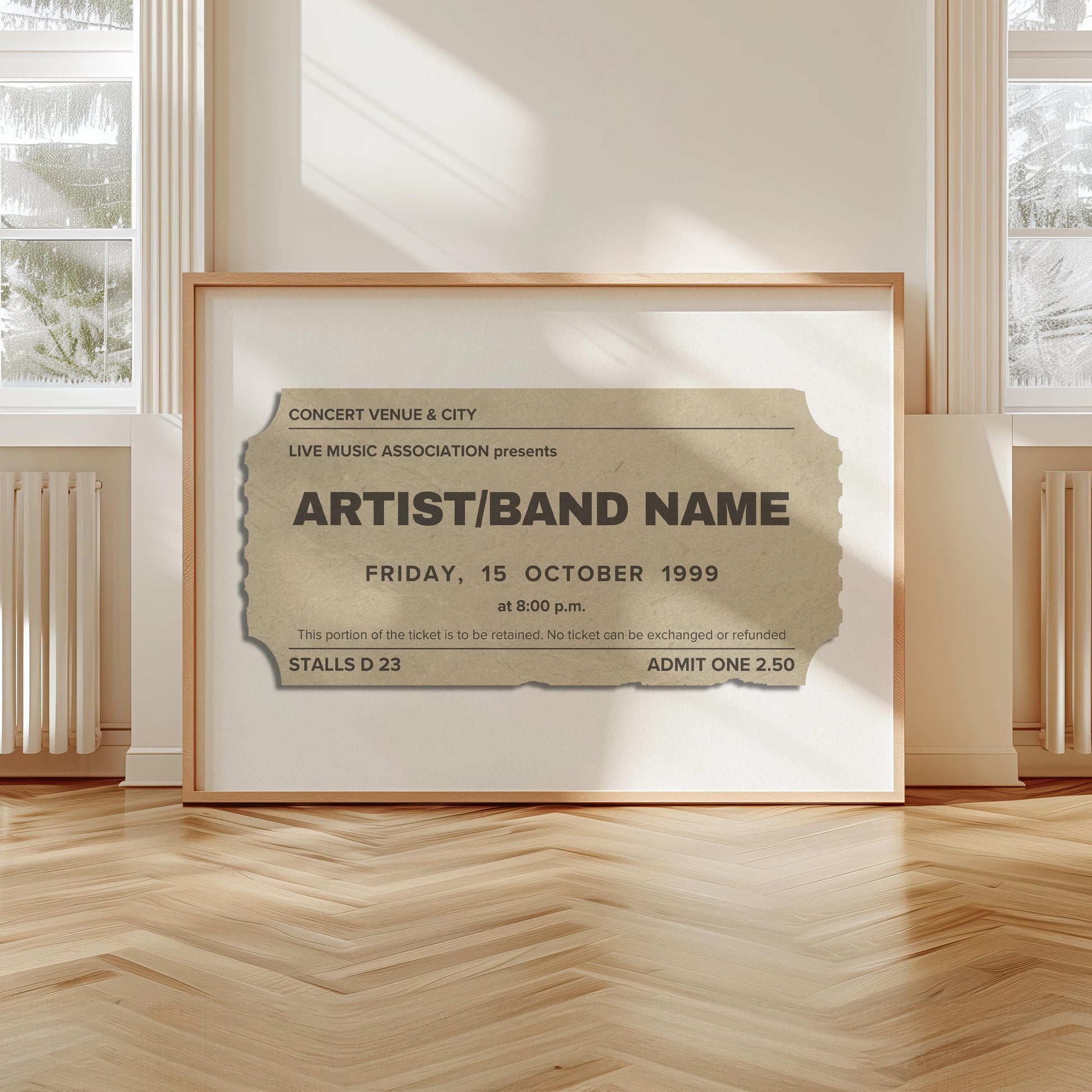 A scandi modern apartment with a large horizontal print leaning on the wall. The art is of a vintage concert ticket stub with personalised text on them.