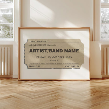 A scandi modern apartment with a large horizontal print leaning on the wall. The art is of a vintage concert ticket stub with personalised text on them.
