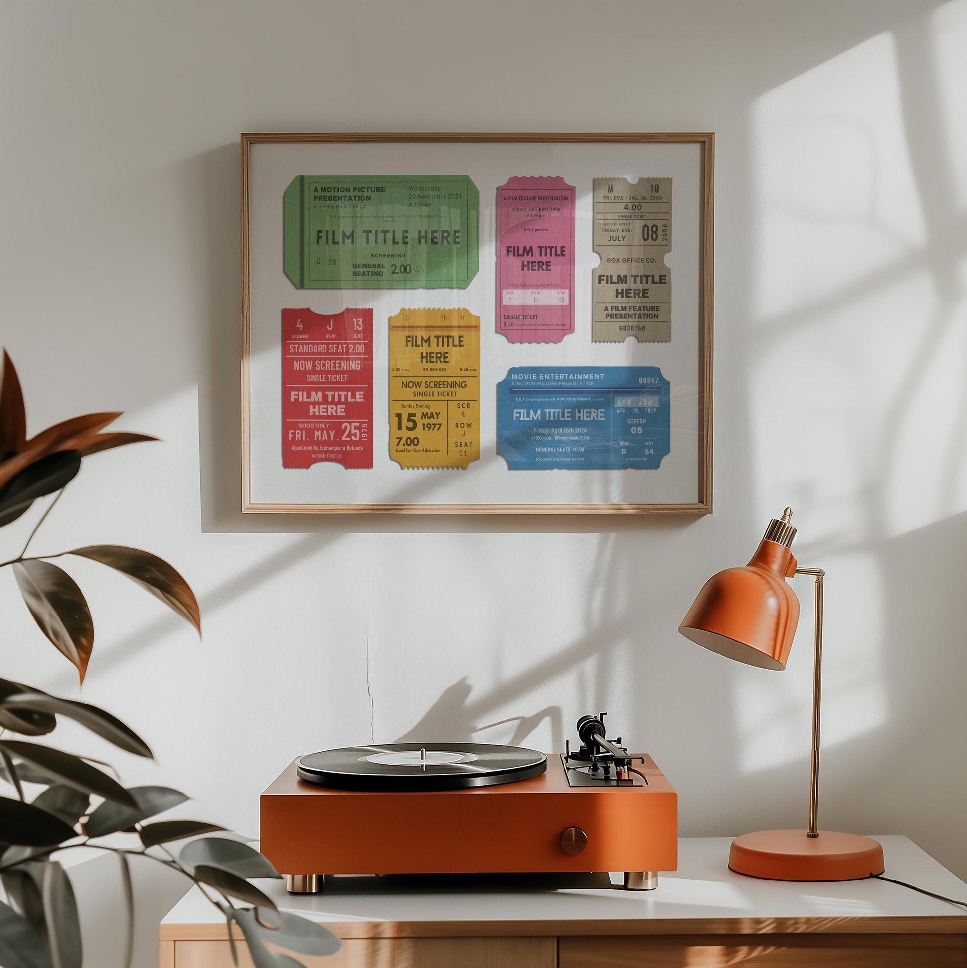 a retro style home with a wood framed poster with personalised cinema theatre passes on it
