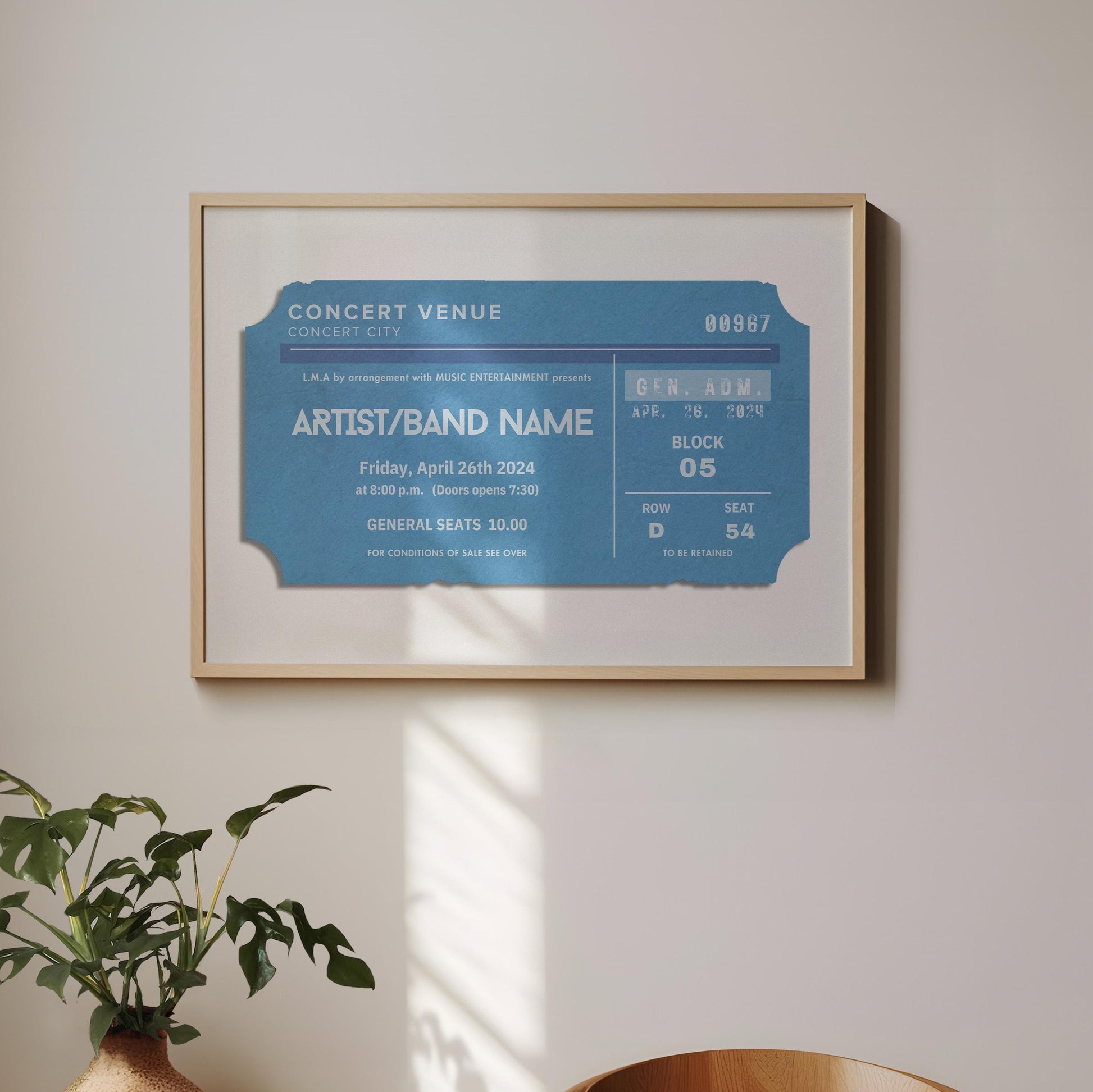 A boho minimalist dining room with a plant and wood chair. On the wall is a horizontal oak frame with a print with a muted blue colour on it. The art is eclectic, retro and an ideal gift for music lovers.