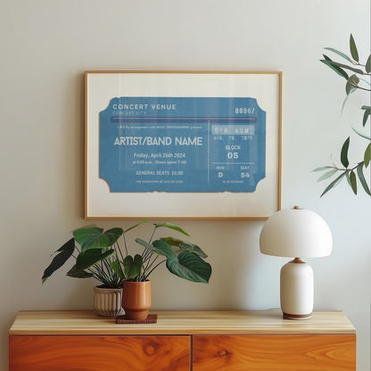 A blue old style ticket stub on a print in a bedroom. The art is minimal yet personal and fits in the modern space.