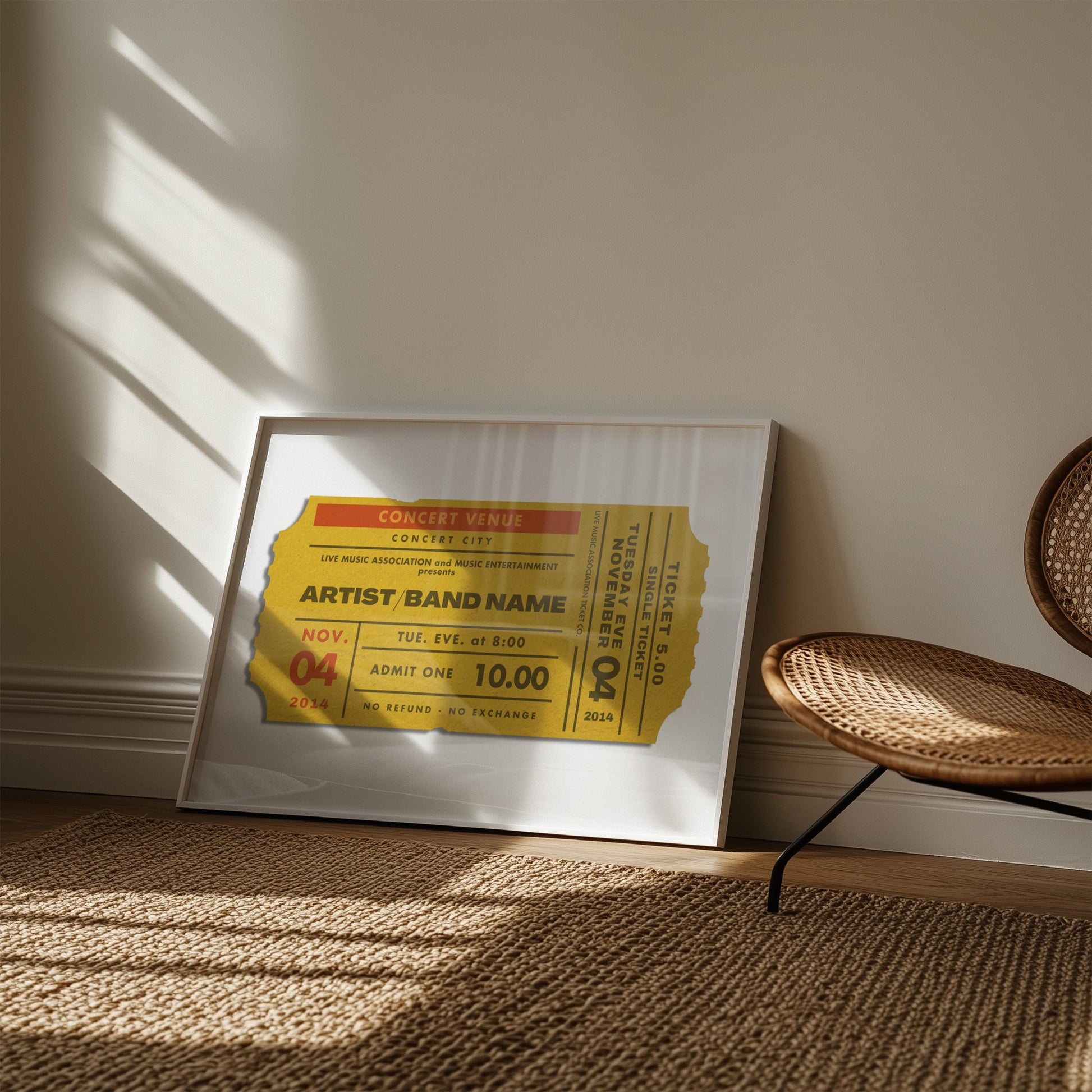 A living room with a rattan rug and chair. On the floor is a retro mustard colour poster featuring a ticket stub inspired by old concert event passes.