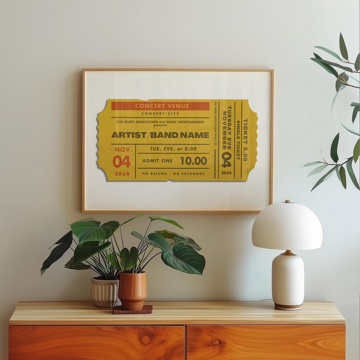 A yellow old style ticket stub on a print in a bedroom. The art is minimal yet personal and fits in the modern space.