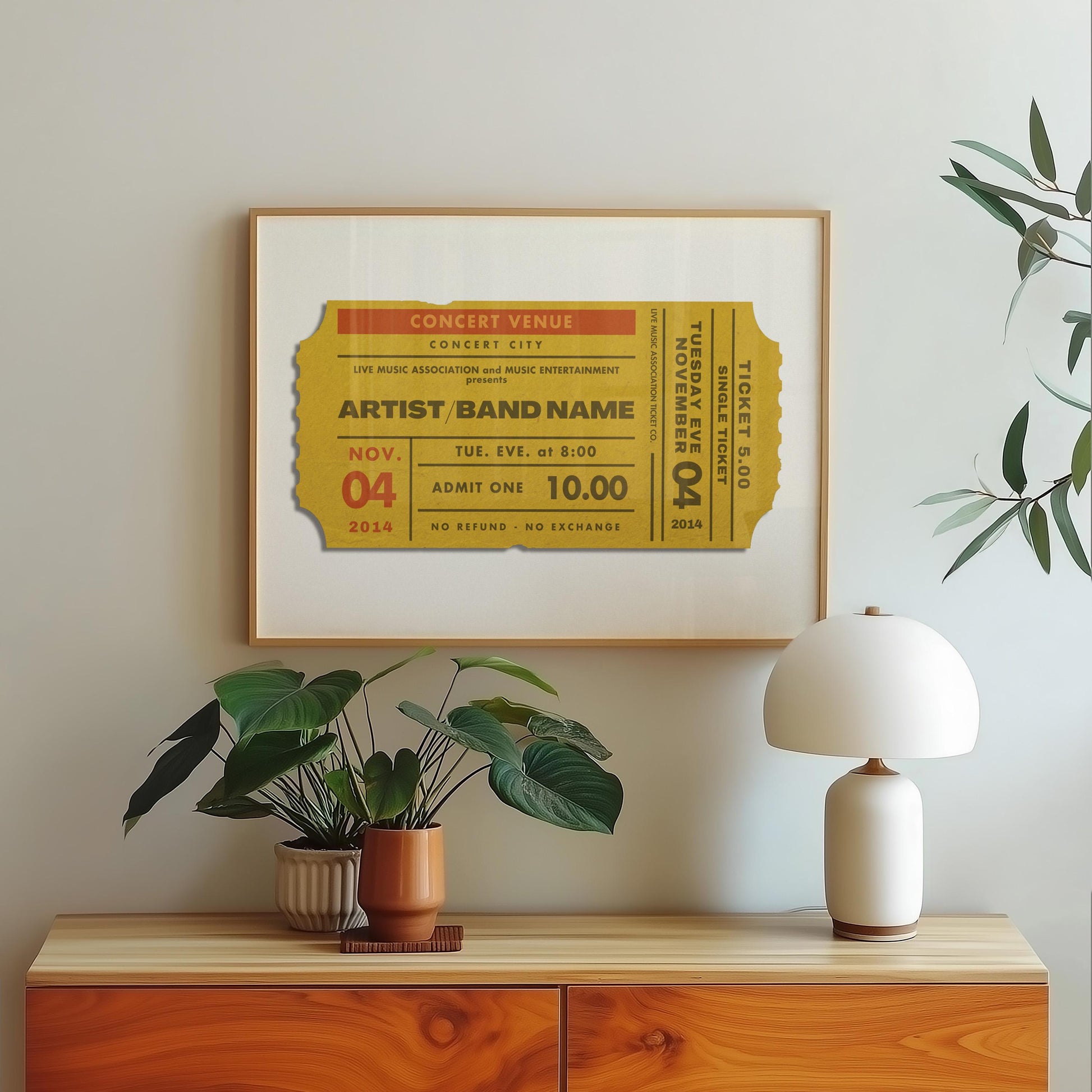 A yellow old style ticket stub on a print in a bedroom. The art is minimal yet personal and fits in the modern space.