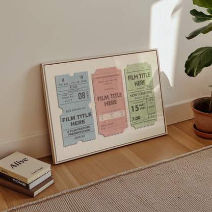 The corner of a mid century style office space with a framed poster on the floor. The art is bespoke nostalgic film ticket stubs with custom details.