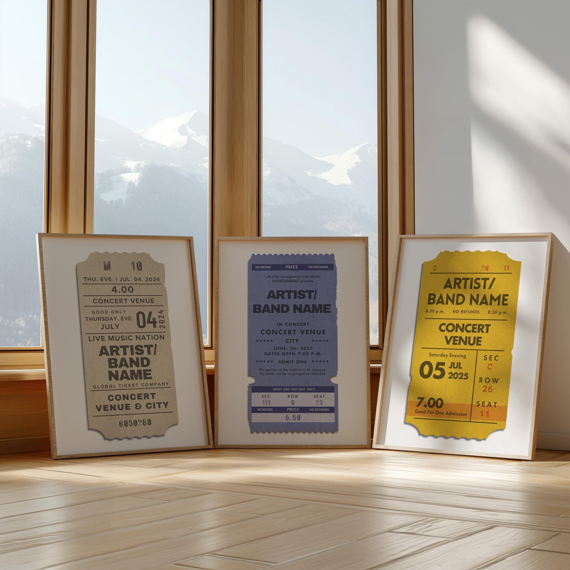 Three colourful art prints leaning against a large window in a livingroom. The art is a vintage blue, beige and yellow design inspired by old live music ticket stubs.