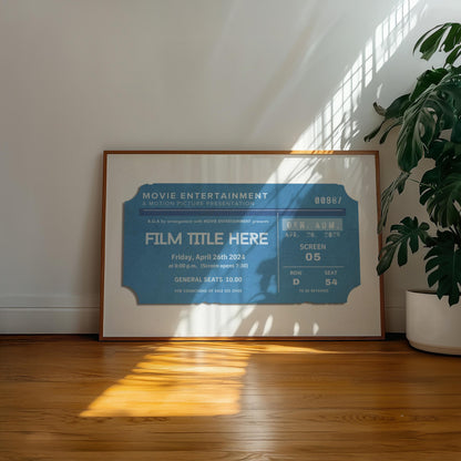A well lit hallway with a poster leaning on the wall in a wood framing. The poster shows a designed old movie theatre stub with a bespoke film title on it.