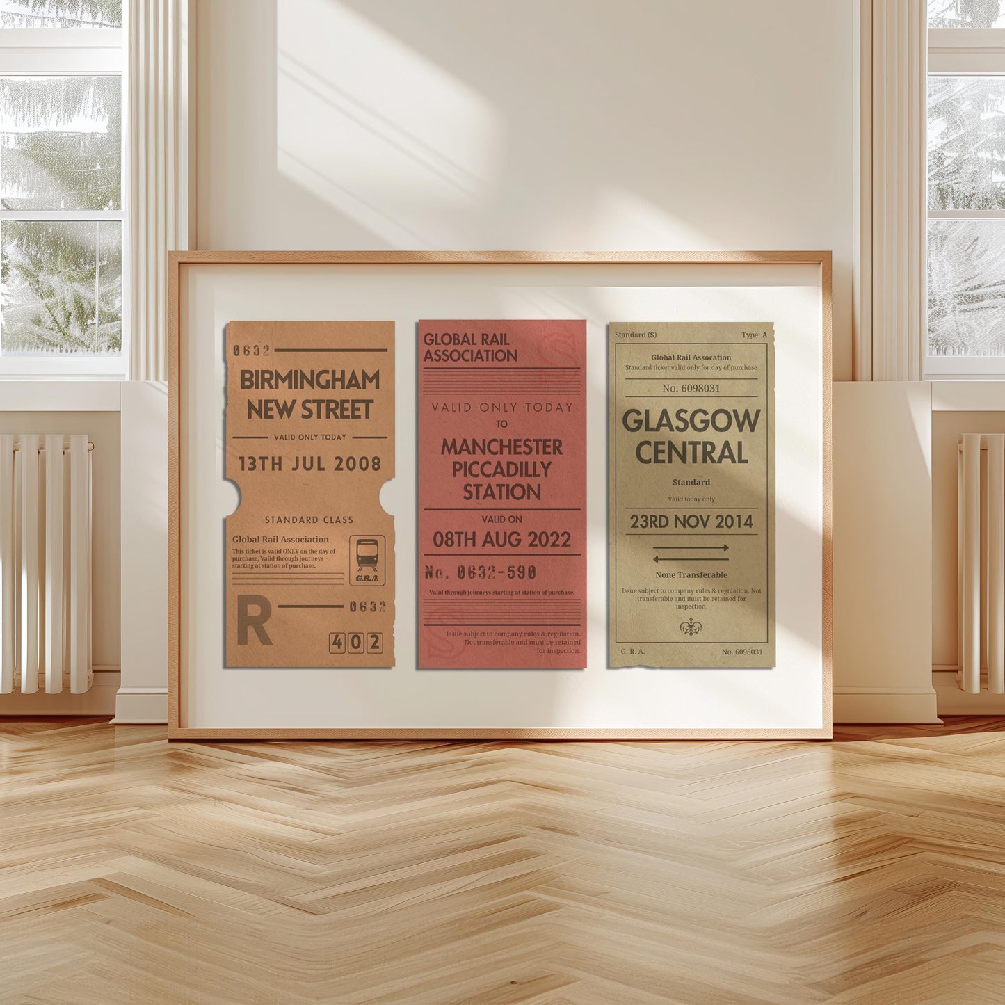 A livingroom with wood herringbone floor and a large art print. It is a custom vintage train ticket stub poster to show off your travels and holidays.