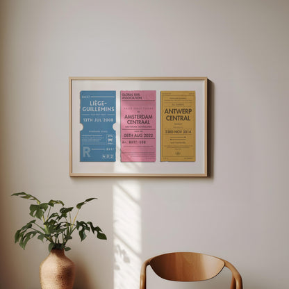 A minimal dining room with a wood curved chair and a plant. On the wall is a framed print of personalised interrail luggage tags, inspired my old stubs to make a design for frequent travellers and holiday keepsake collectors