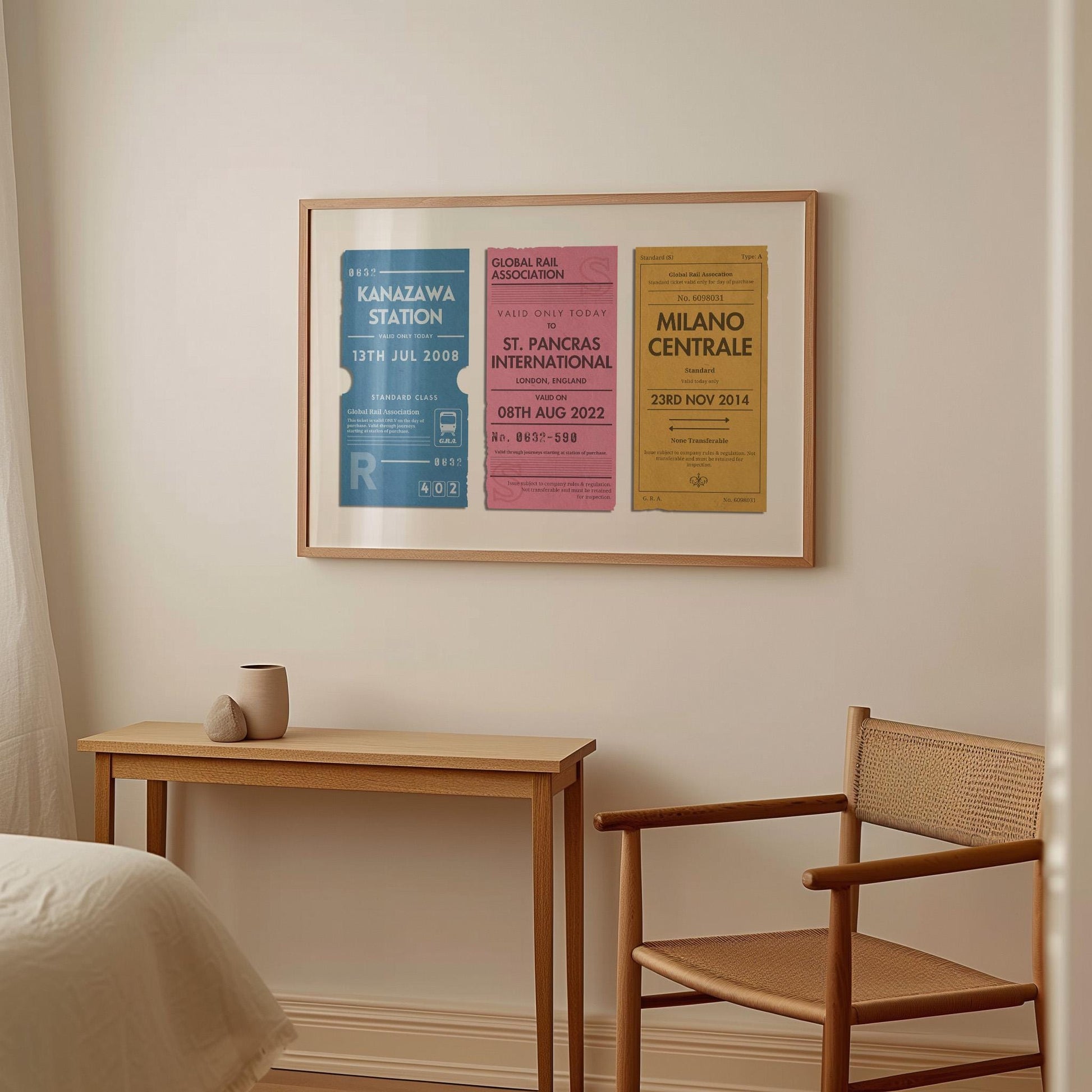 A warm light wood furnished bedroom with a large horizontal framed wall art. It is a custom unique print with three rail tags on it designed as a memory filled gift for holidays, gap years or honeymoon décor.