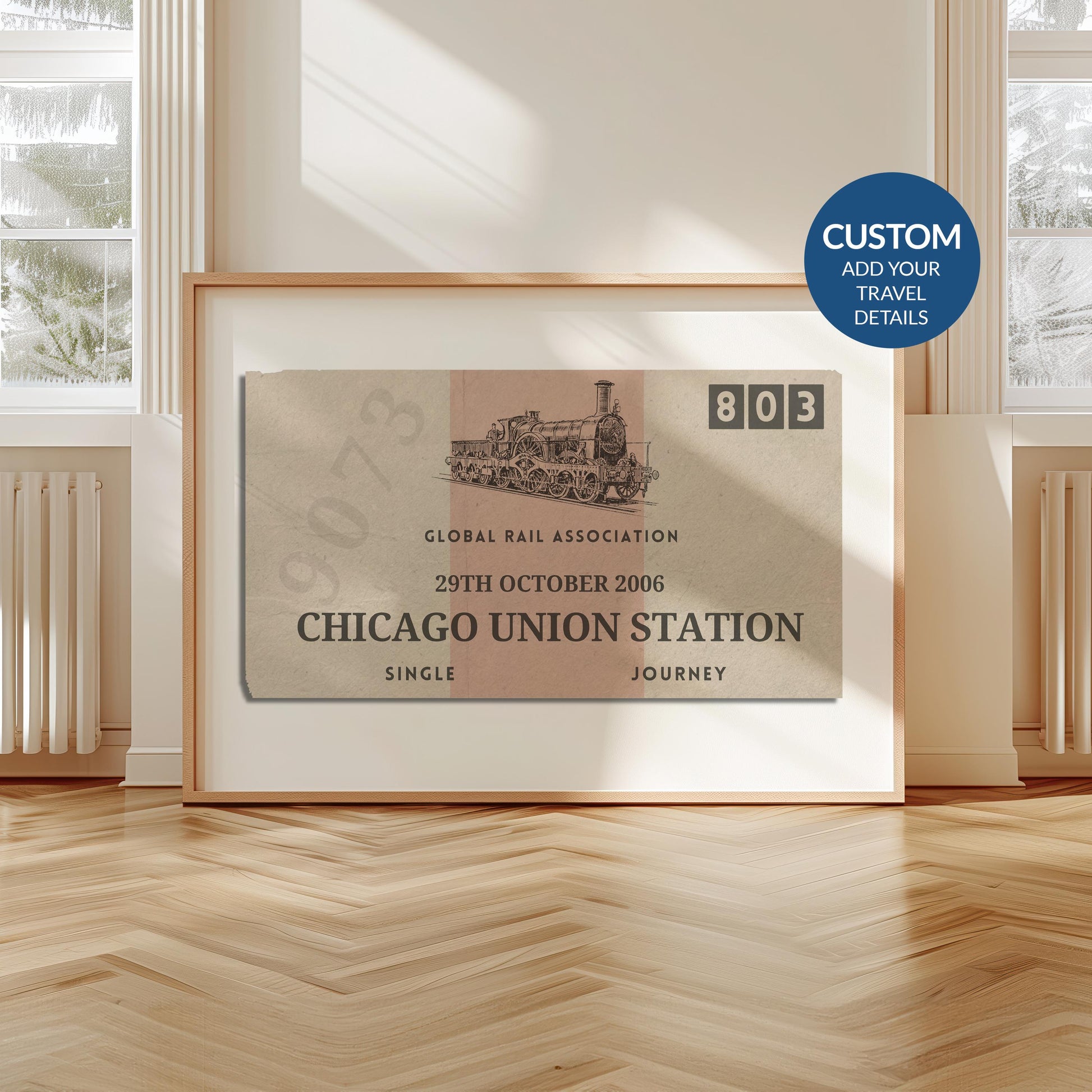 A livingroom with wood herringbone floor and a large art print. It is a custom vintage train ticket stub poster to show off your travels and holidays.