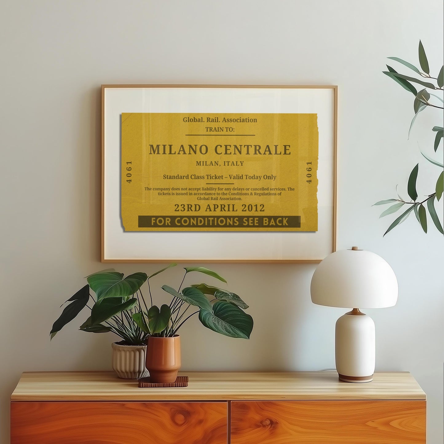 A scandinavian style home with a wood framed poster on the wall which shows a personalised train ticket stub on it. The art is vintage, rustic and bespoke.