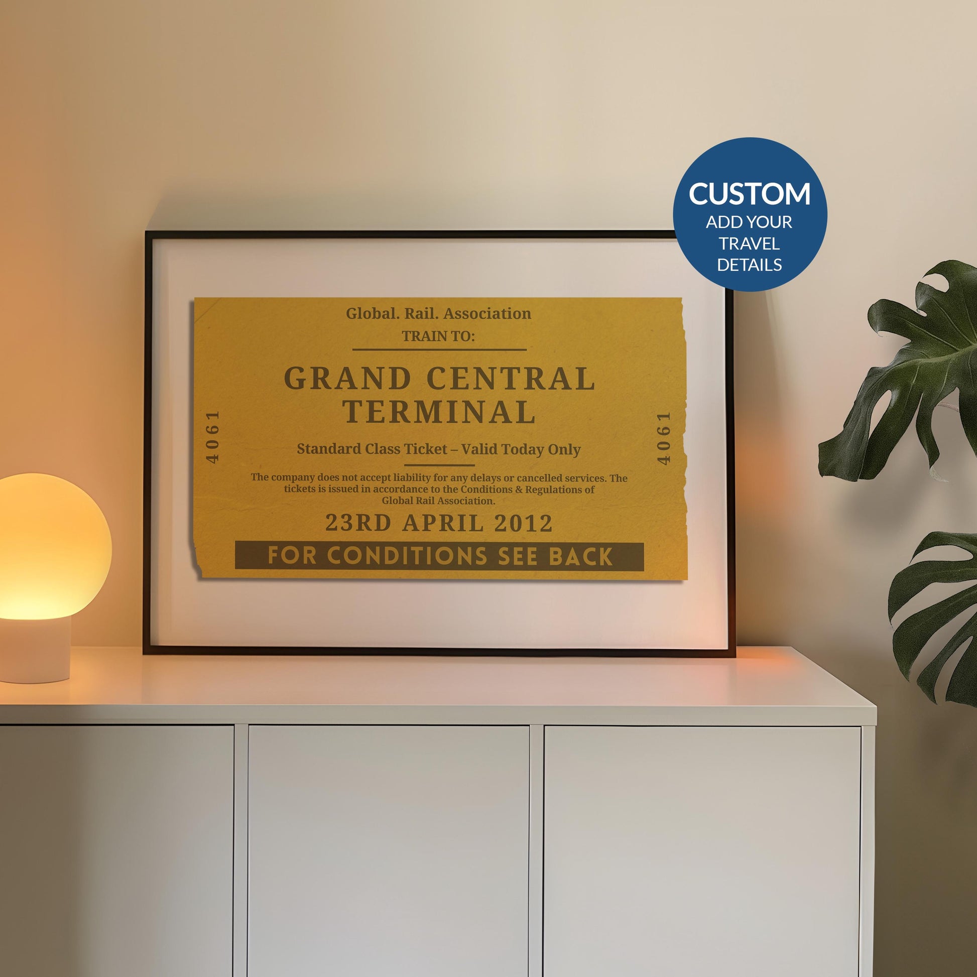 A cosy bedroom with a white sideboard. A poster is on top leaning on the wall which is a one of a kind railway stub artwork made for travel lovers as a keepsake for rail journeys and holidays.