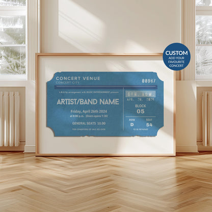 A scandi modern apartment with a large horizontal print leaning on the wall. The art is of a vintage concert ticket stub with personalised text on it.