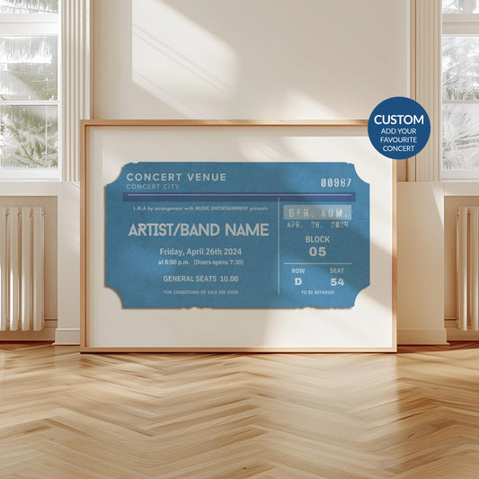 A scandi modern apartment with a large horizontal print leaning on the wall. The art is of a vintage concert ticket stub with personalised text on it.