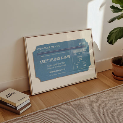 A modern home living room with a vintage blue poster in a landscape frame. The art is inspired by old concert live event ticket stubs and has customisable text to add your event.