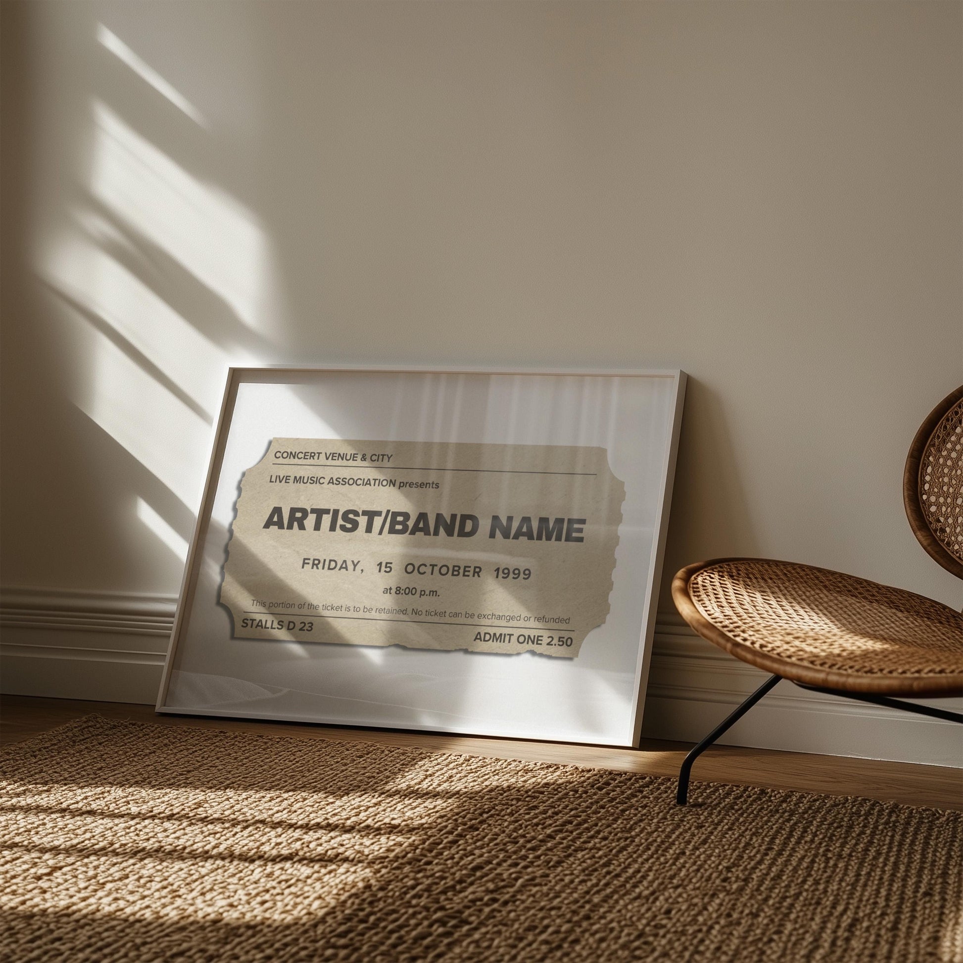A rattan rug and chair in a boho living room space. A neutral coloured retro print is framed and leaning on the wall. It is inspired by concert event stubs with personalised details so make a music keepsake.