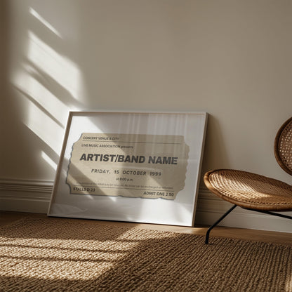 A rattan rug and chair in a boho living room space. A neutral coloured retro print is framed and leaning on the wall. It is inspired by concert event stubs with personalised details so make a music keepsake.