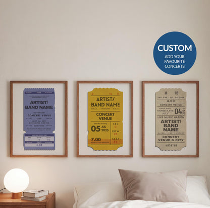 A cosy bedroom with three colourful prints hung above the bed. The posters are designed to look like live music event passes with personalised details on them to make a music memory art piece.