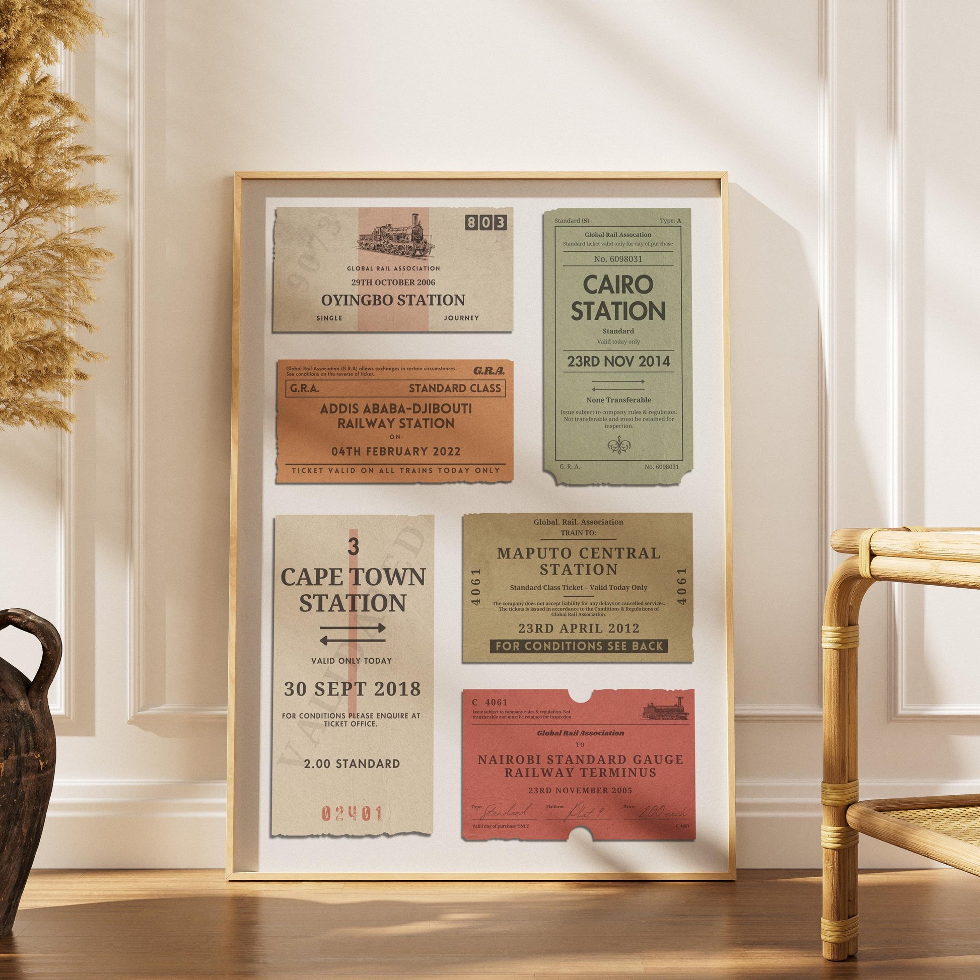 a scandinavian style home with a wood framed poster with personalised train tickets on it