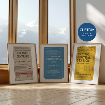 Three framed prints in front of a large window in yellow, beige and blue colour schemes. Each are rustic old train ticket designs with personalised text on each.