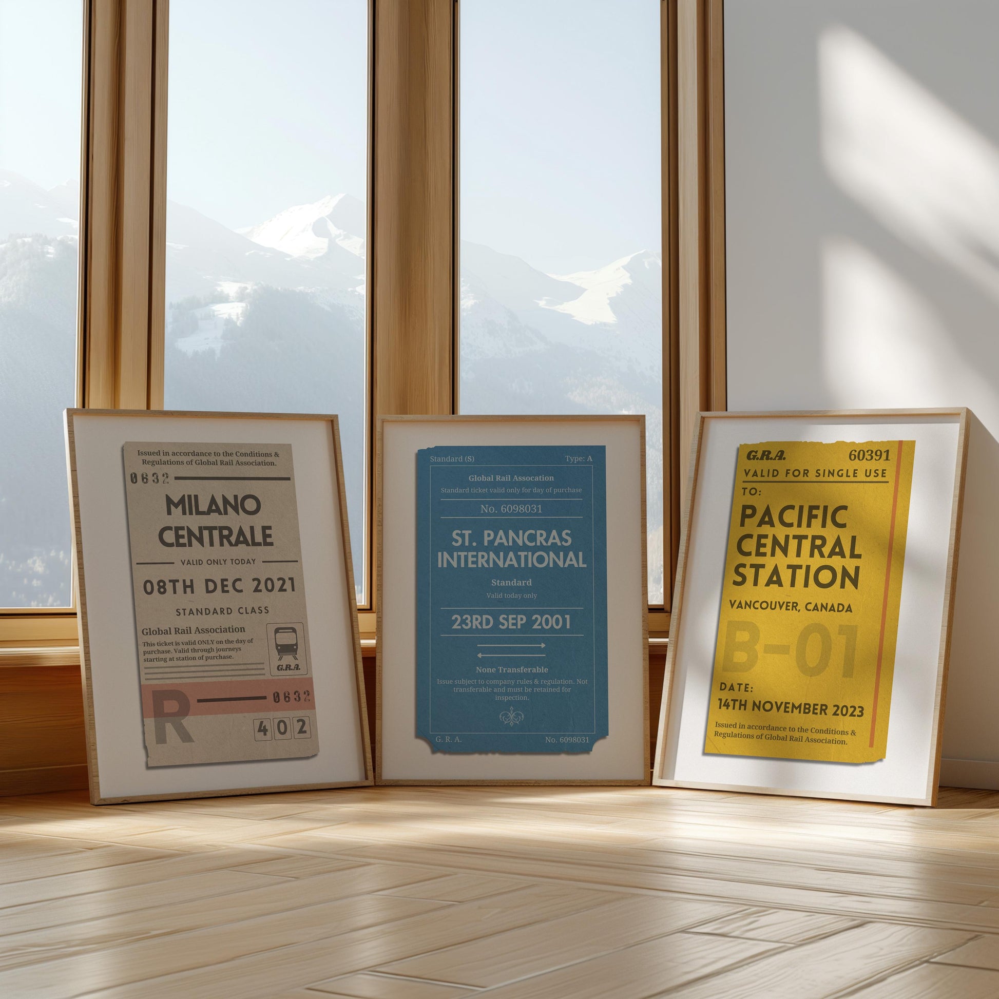 Three framed prints in front of a large window in yellow, beige and blue colour schemes. Each are rustic old train ticket designs with personalised text on each.