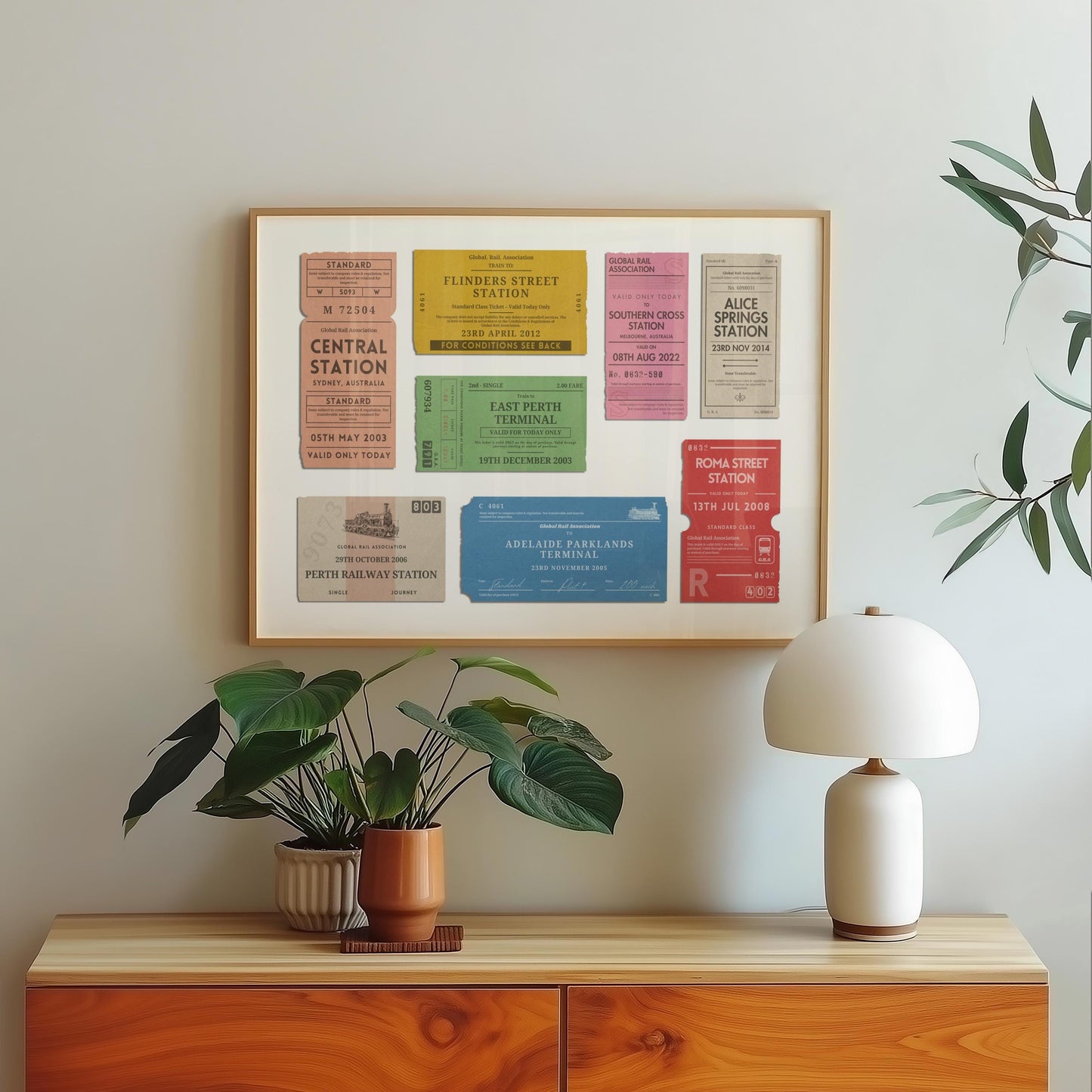 A scandinavian style home with a wood framed poster on the wall which shows personalised train ticket stubs on it. The art is vintage, rustic and bespoke.