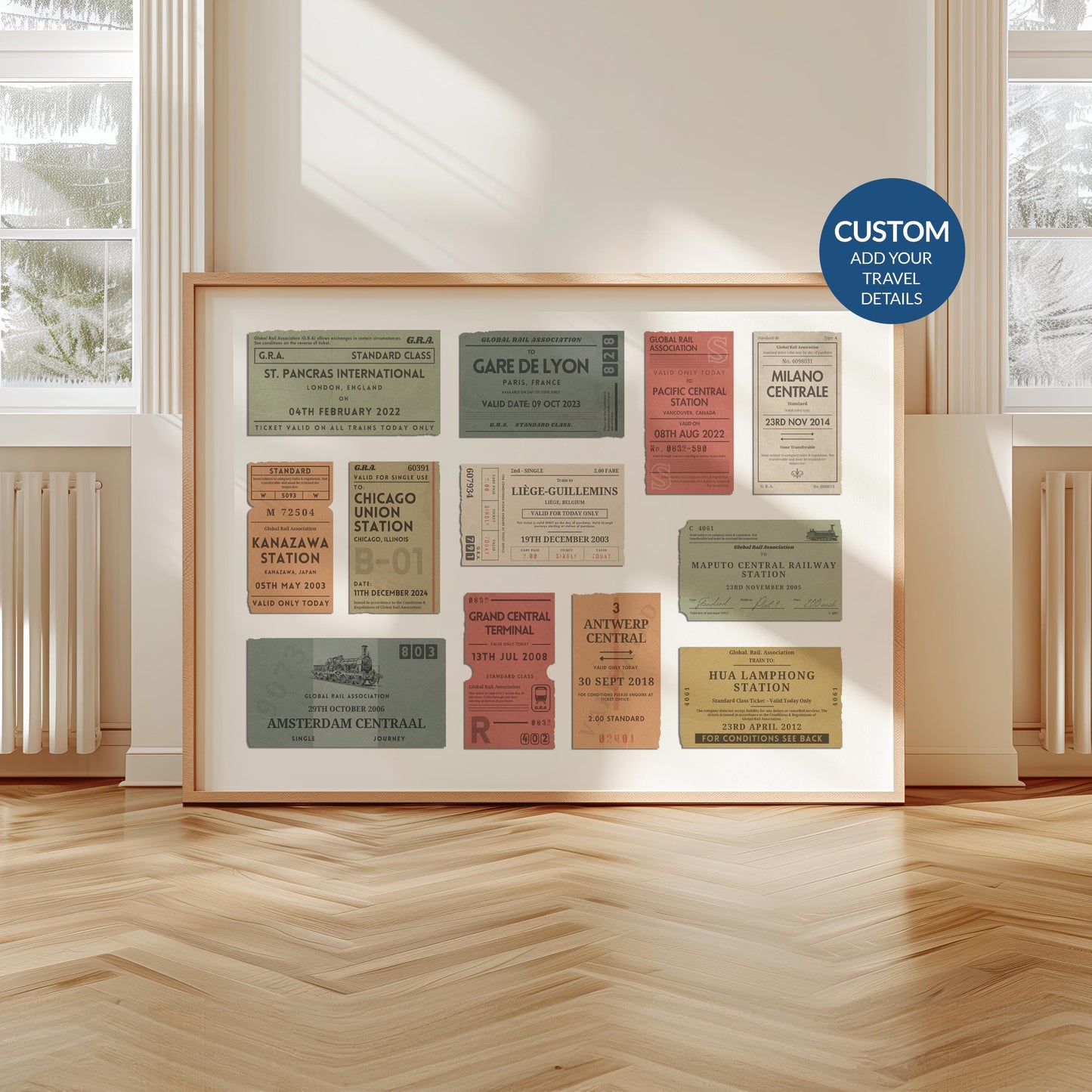 A livingroom with wood herringbone floor and a large art print. It is a custom vintage train ticket stub poster to show off your travels and holidays.