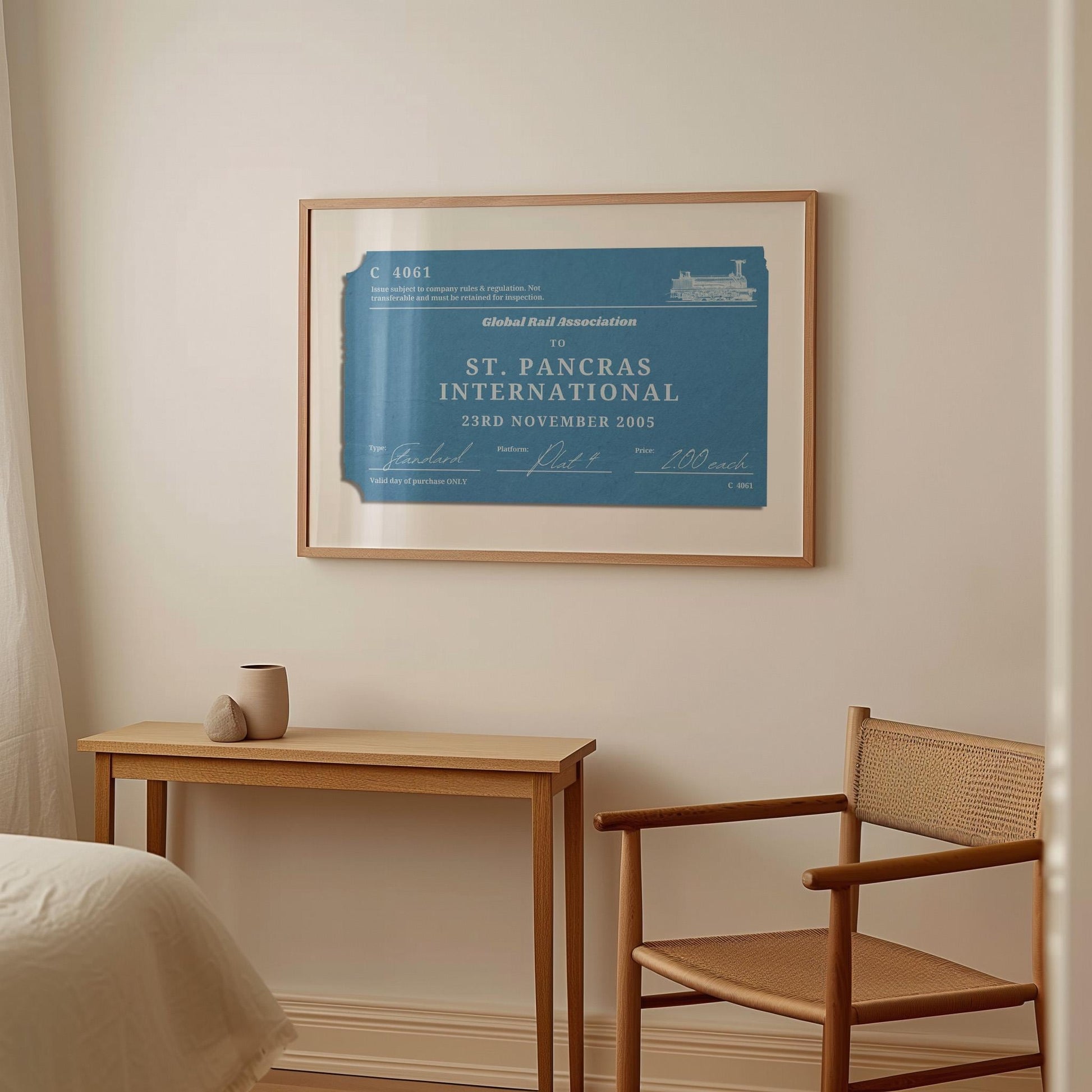A warm light wood furnished bedroom with a large horizontal framed wall art. It is a custom unique rail tag print designed as a memory filled gift for holidays, gap years or honeymoon décor.