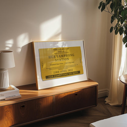 A mid century style cosy bedroom with a mustard colour print made for travel lovers and their trips. The art is inspired by old ticket stubs and luggage tags.
