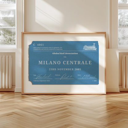 A livingroom with wood herringbone floor and a large art print. It is a custom vintage train ticket stub poster to show off your travels and holidays.