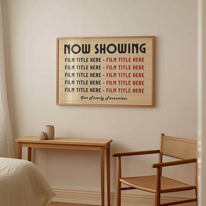 A bedroom with soft rattan and wood furniture featuring a large horizontal framed print. The print is a vintage yellow colour with marquee style details showing 10 personalised film titles chosen by the gift recipient.