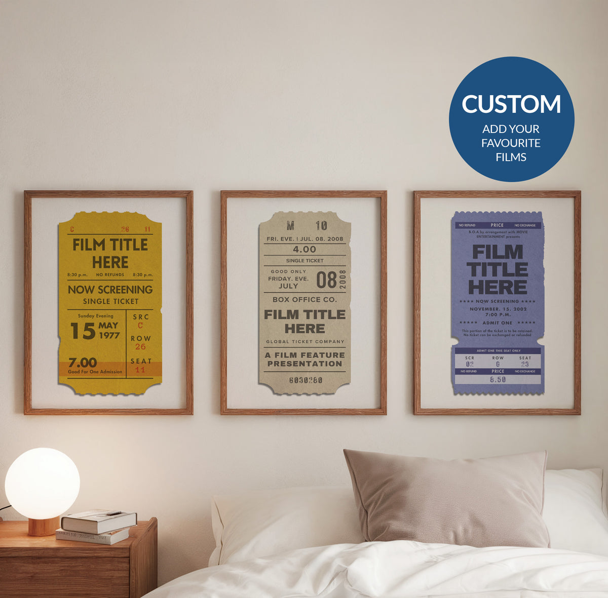 Three framed vintage movie ticket posters in yellow, beige, and blue hang on a beige wall above a bed. A blue circular badge in the top right says 'CUSTOM ADD YOUR FAVOURITE FILMS'.